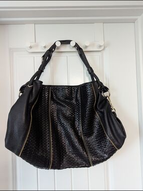 BCBGMaxAzria Black Leather Hobo Bag with Burgundy Lining